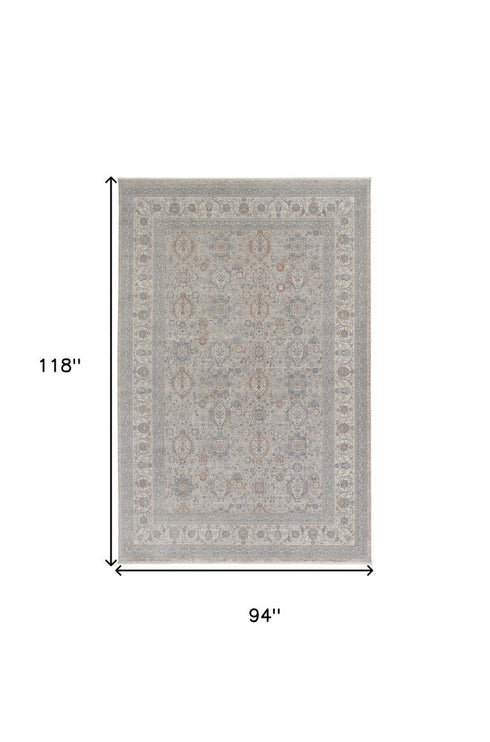 7' X 10' Silver Taupe and Blue Oriental Power Loom Worn Faded Area Rug With Fringe